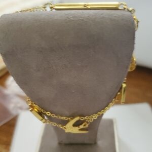 ALEXANDER MCQUEEN Elegant Gold Bird Charm Bracelet